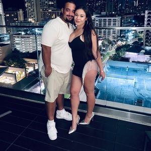 Black dress with jewels hanging on side